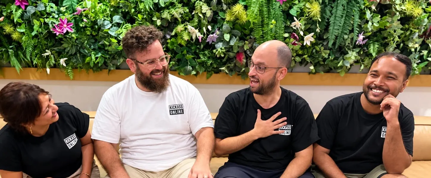 The same four, laughing together
