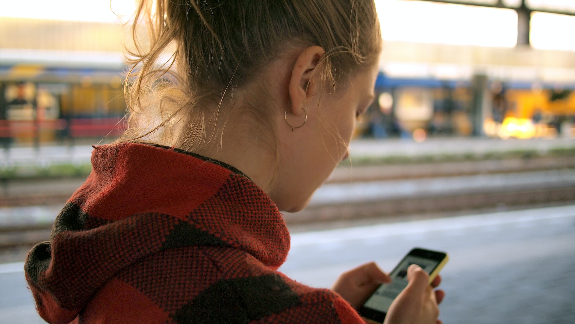 woman looking at website through mobile