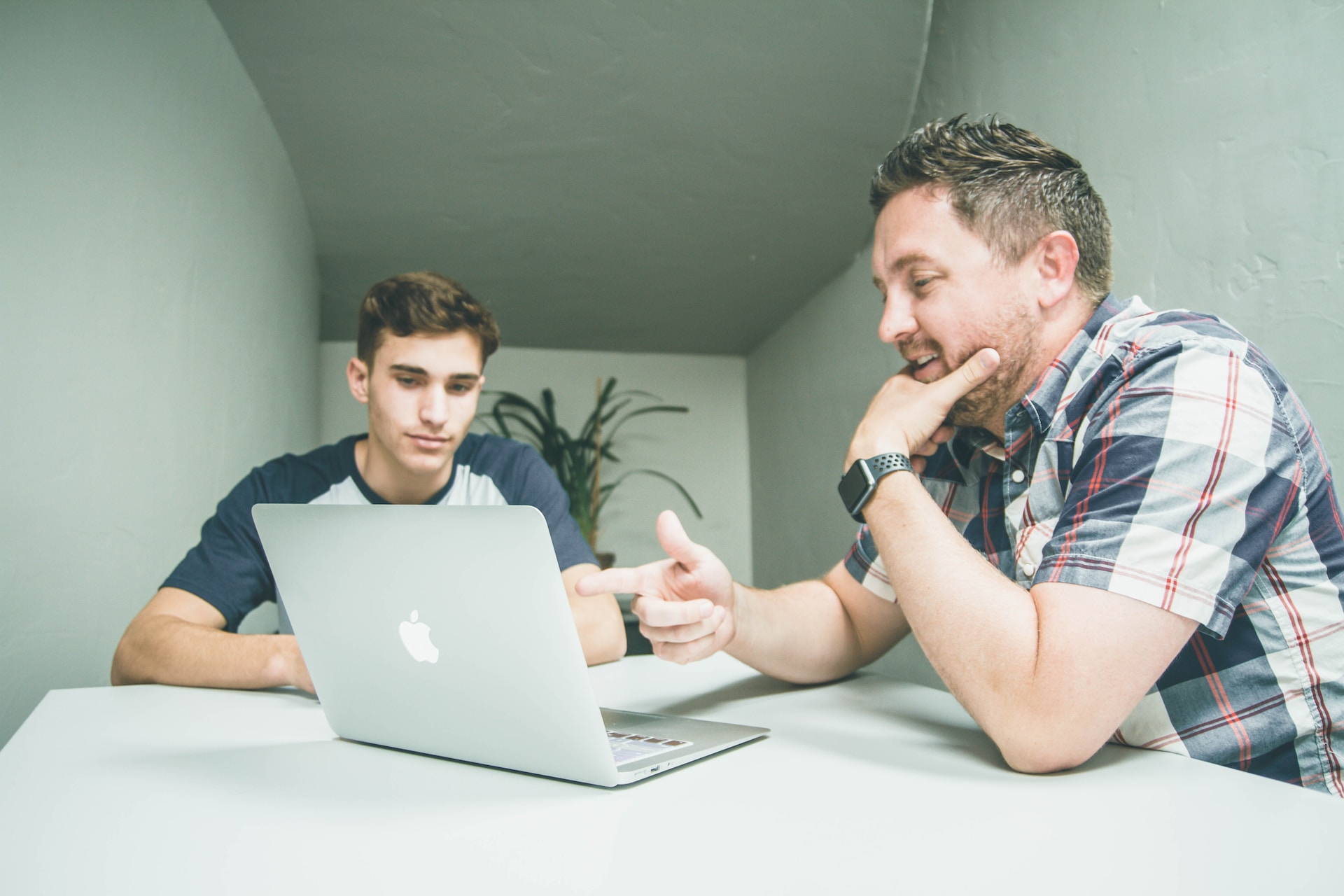 men working on laptop